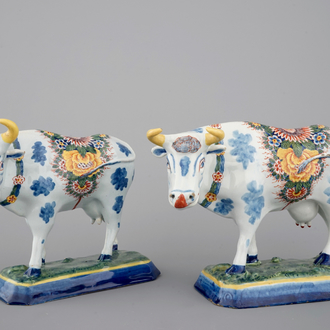 A pair of polychrome Dutch Delft models of cows, 18th C.
