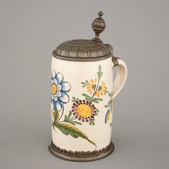 A beer stein with pewter lid and floral decoration, 18th C., Germany