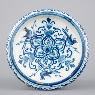 A small blue and white Dutch Delft round bowl on feet, 18th C.