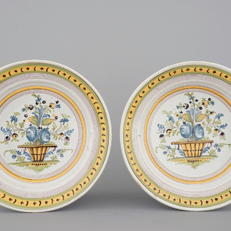 A pair of Brussels faience plates with flower vases, 18th C.