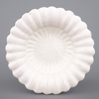 A good Dutch Delft monochrome white fluted charger, late 17th C.