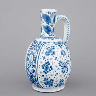A large Dutch Delft blue and white jug, 18th C.