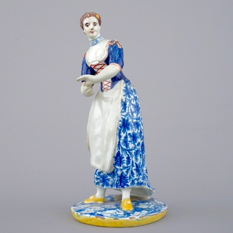 A tall polychrome Dutch Delft figure of a lady, ca. 1800