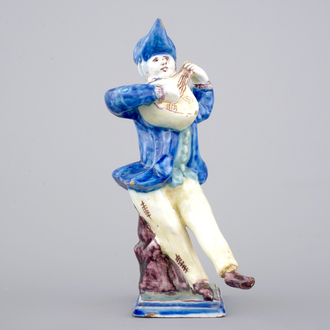 A French faience figure of a violin player, ca. 1800