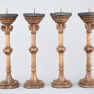 A set of 4 tall gothic revival wooden candlesticks, 19th C.