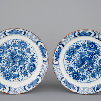 A pair of Dutch Delft blue and white plates with a chinoiserie design of dragons, 18th C.