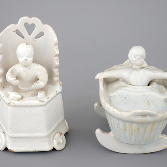 Two monochrome white Dutch Delft figures of children, 18th C.