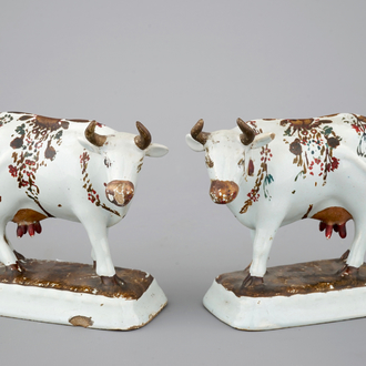 A pair of white Delft cold-painted cows, Dutch, 18th C.