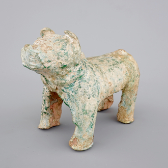 A Chinese green glazed pottery figure of a dog, presumably Han Dynasty