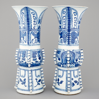 An unusual pair of tall Chinese blue and white porcelain gu-shaped vases, Kangxi, ca. 1700