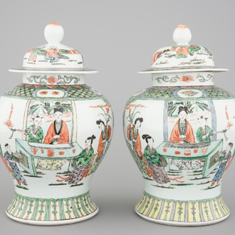 A pair of Chinese famille verte porcelain baluster vases and covers, 19th C.