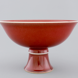 A Chinese porcelain copper-red glazed bowl on foot, 19/20th C.