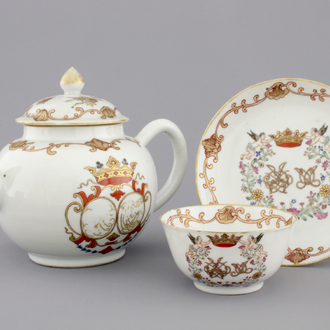 A Chinese porcelain famille rose and gilt armorial monogrammed teapot with a cup and saucer, 18th C.