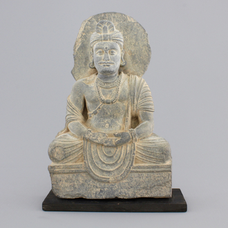 A gray schist figure of a seated Buddha, Gandhara, prob. 2nd/3rd C.