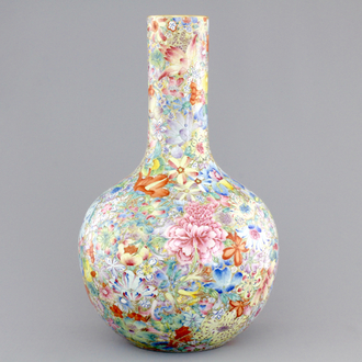 A Chinese famille rose porcelain millefleurs bottle vase, 19th C.