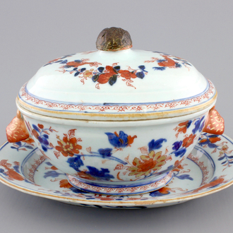 A Chinese porcelain imari tureen and cover on stand, decorated with fish, 18th C.