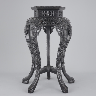 An intricately carved Chinese hardwood marble top vase stand, 19th C.