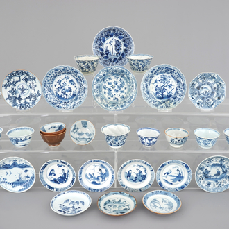 A large collection of Chinese blue and white cups and saucers, mostly Kangxi, 18th C.