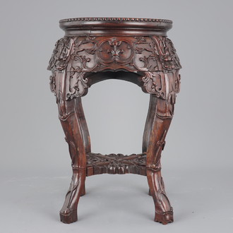 A finely carved Chinese hardwood marble top vase stand, 19th C.