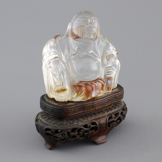 A Chinese rock crystal Buddha on stand, 18/19th C.