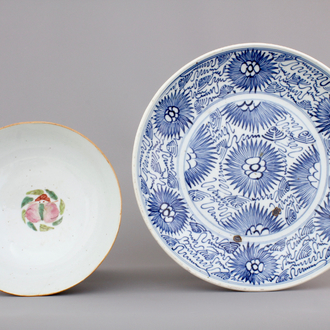 A blue and white Chinese porcelain plate with flowers and a famille rose bowl, 18th C.