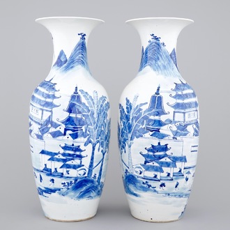 A tall pair of blue and white Chinese porcelain vases, 19th C.