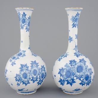 A pair of Dutch Delft blue and white bottle-shaped vases, 17th C.