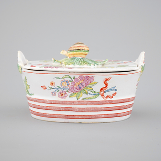 A Dutch Delft polychrome butter tub with a snail-shaped finial, 18th C.