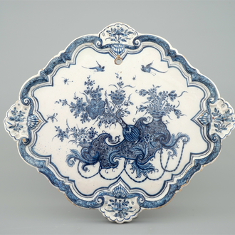 A Dutch Delft blue and white plaque with flower vases, 18th C.