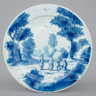 A fine Dutch Delft blue and white plate with a pastoral scene, 18th C.