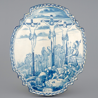 A large Dutch Delft blue and white Crucifixion plaque, Rotterdam, 18th C.