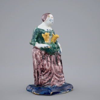 A Dutch Delft polychrome figure of a lady, 18th C.