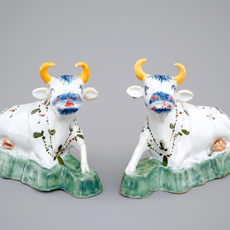 A pair of polychrome Dutch Delft models of cows, 18th C.