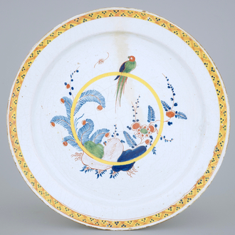A very large polychrome Dutch Delft dish with a parrot, 18th C.