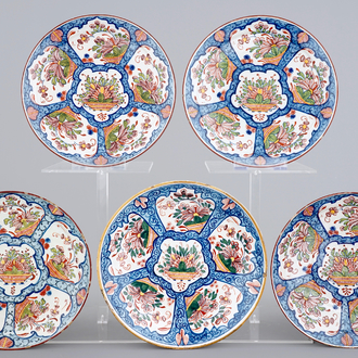 A set of five polychrome Dutch Delft plates with flower baskets, 18th C.