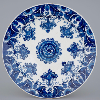 An exceptionally large Dutch Delft blue and white floral dish, 18th C.