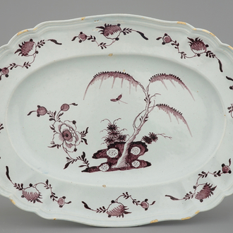 A large oval manganese Dutch Delft floral dish, 18th C.
