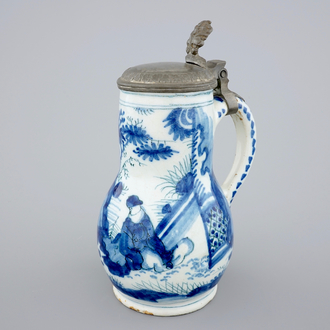 A Dutch Delft blue and white chinoiserie jug with pewter lid, 17th C.