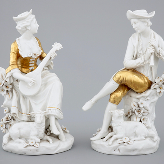 A pair of white and gilt Capodimonte porcelain figures of musicians, 19th C.