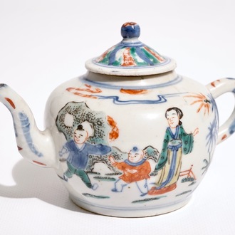 A Chinese wucai teapot and cover with figures in a garden, 19th C.