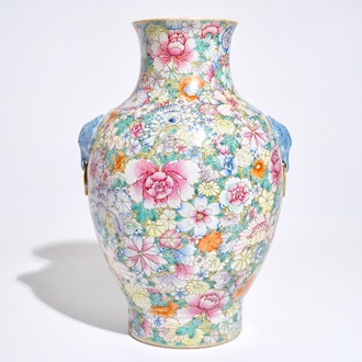 A Chinese famille rose millefleurs hu vase, Qianlong mark, 19/20th C.