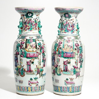 A pair of tall Chinese famille rose vases with court scenes, 19th C.