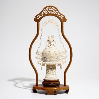 A Chinese encrusted ivory vase on wooden stand, early 20th C.
