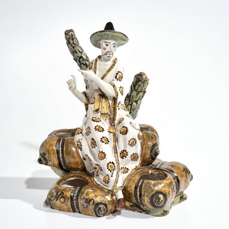 Een inktstel in Franse faïence met decor van een zittende Chinees, Rijsel, 18e eeuw