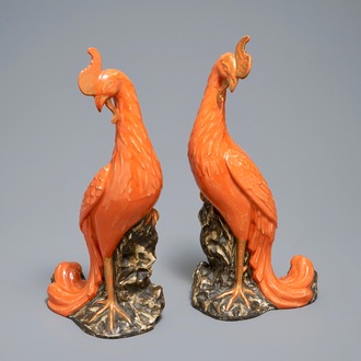 A pair of Chinese coral-ground models of phoenixes, 19/20th C.