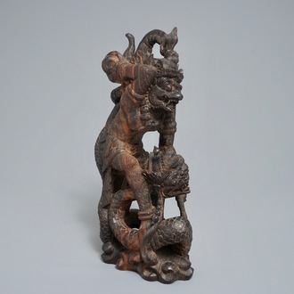 An Indonesian calamandar wooden sculpture of Vishnu riding Naga, 19th C.