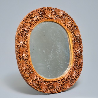 A finely carved Chinese wooden mirror frame, Canton, 19/20th C.