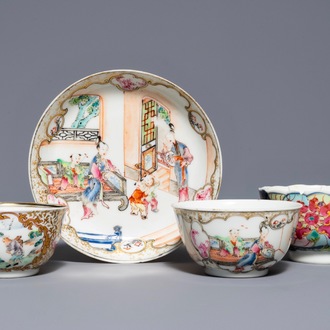 Een Chinese famille rose kop en schotel met mandarijns decor en twee losse koppen, Yongzheng/Qianlong