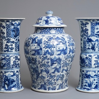 Een groot driedelig Chinees blauwwit kaststel met landschappen en bloemen in vakverdeling, Kangxi