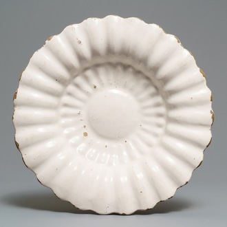 A white Dutch Delft gadrooned dish, 17th C.